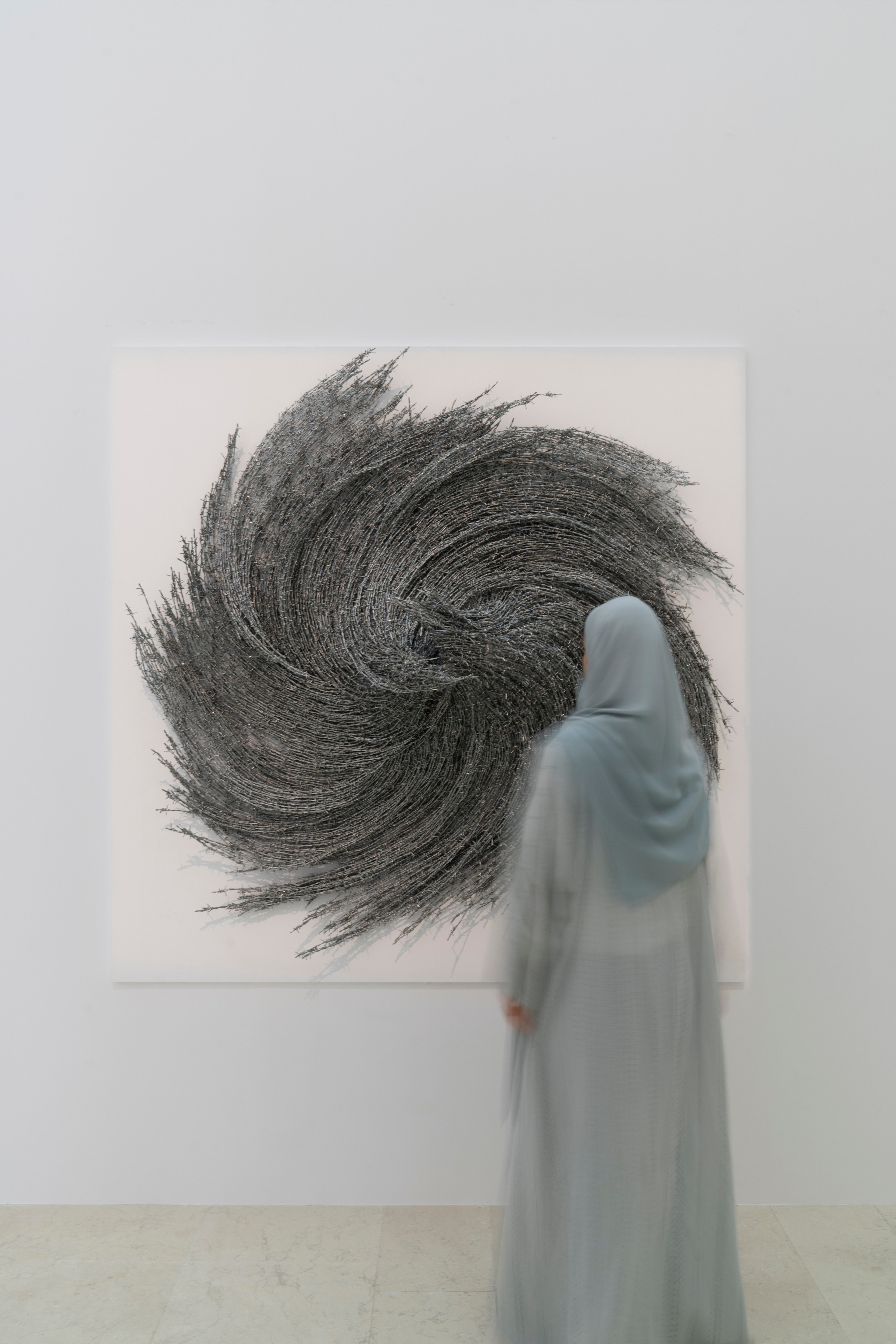 woman in front of a painting